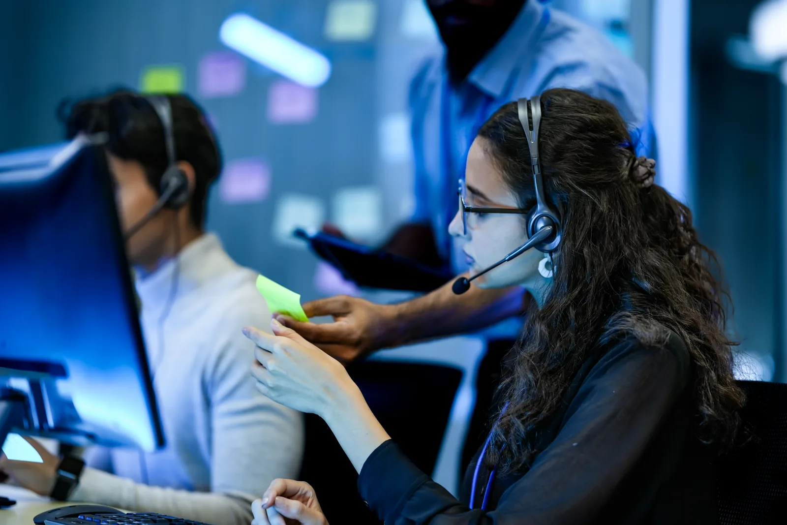 IT support specialist assisting users from a service desk