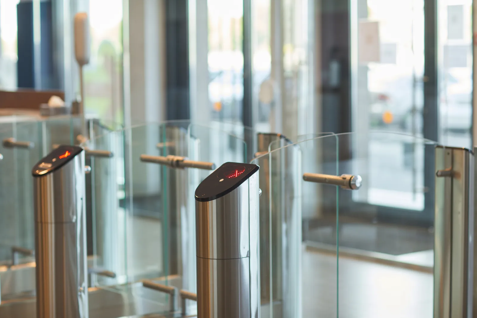 Modern turnstile entry gates in an office lobby